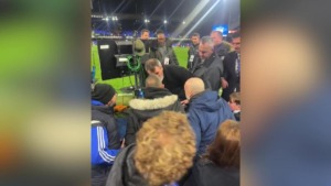 A controversial football myth meets a fan to hit him in the parking lot