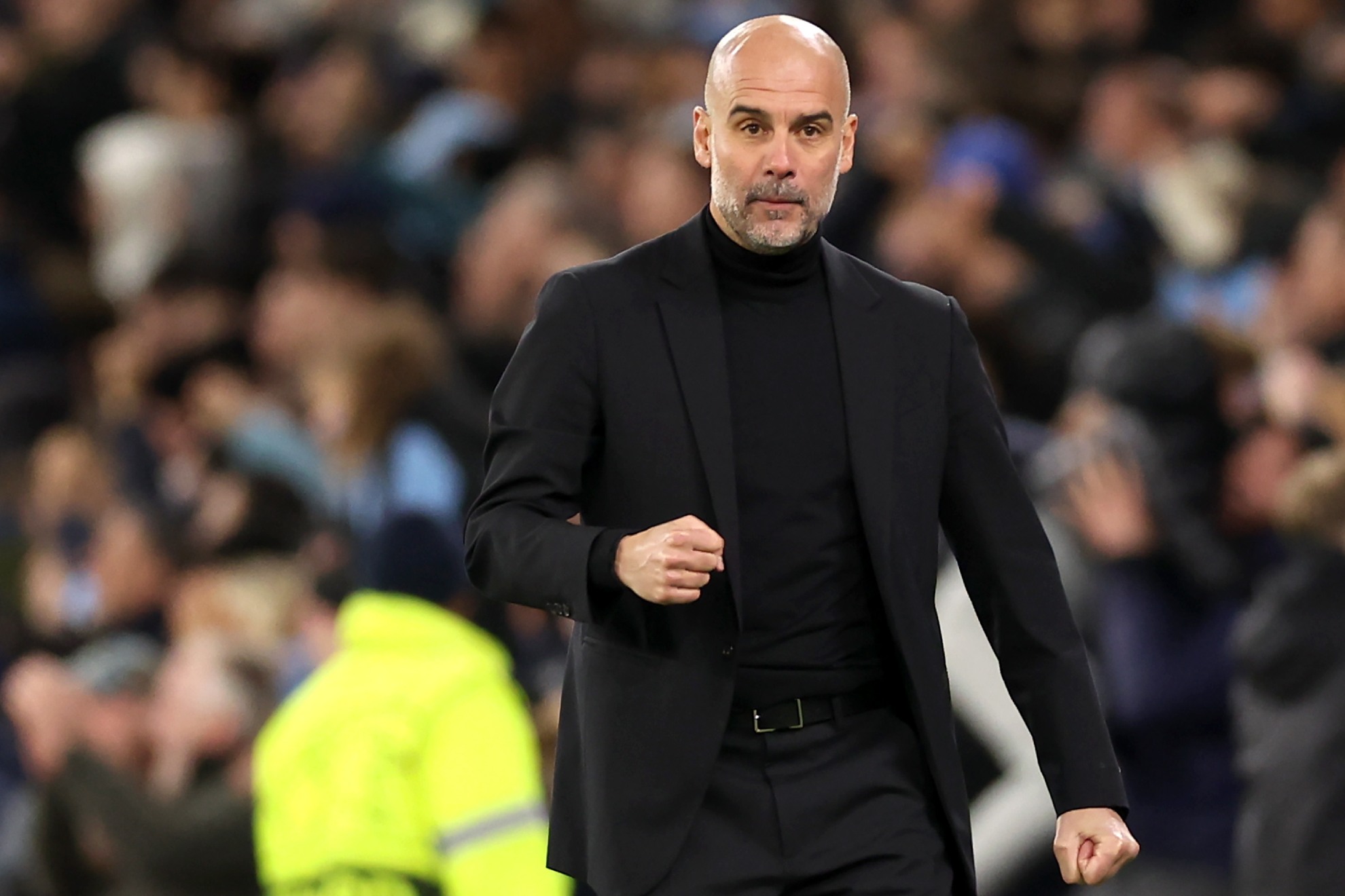 Pep Guardiola celebrates a victory with Manchester City.