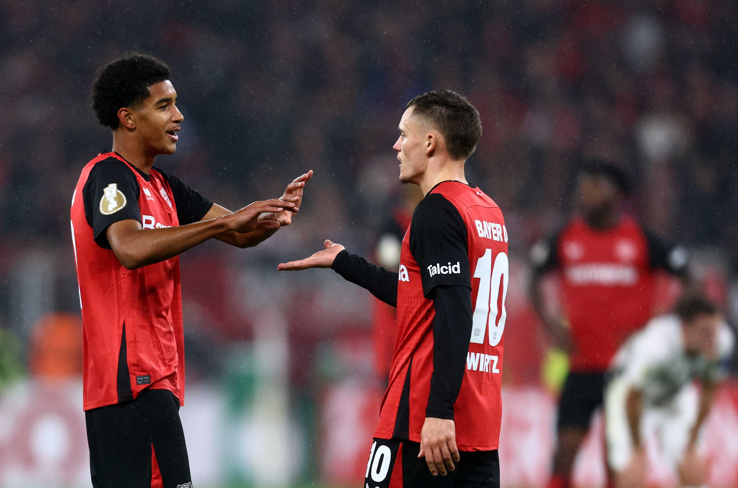 Francis Onyeka greets Florian Wirtz on the day of his debut