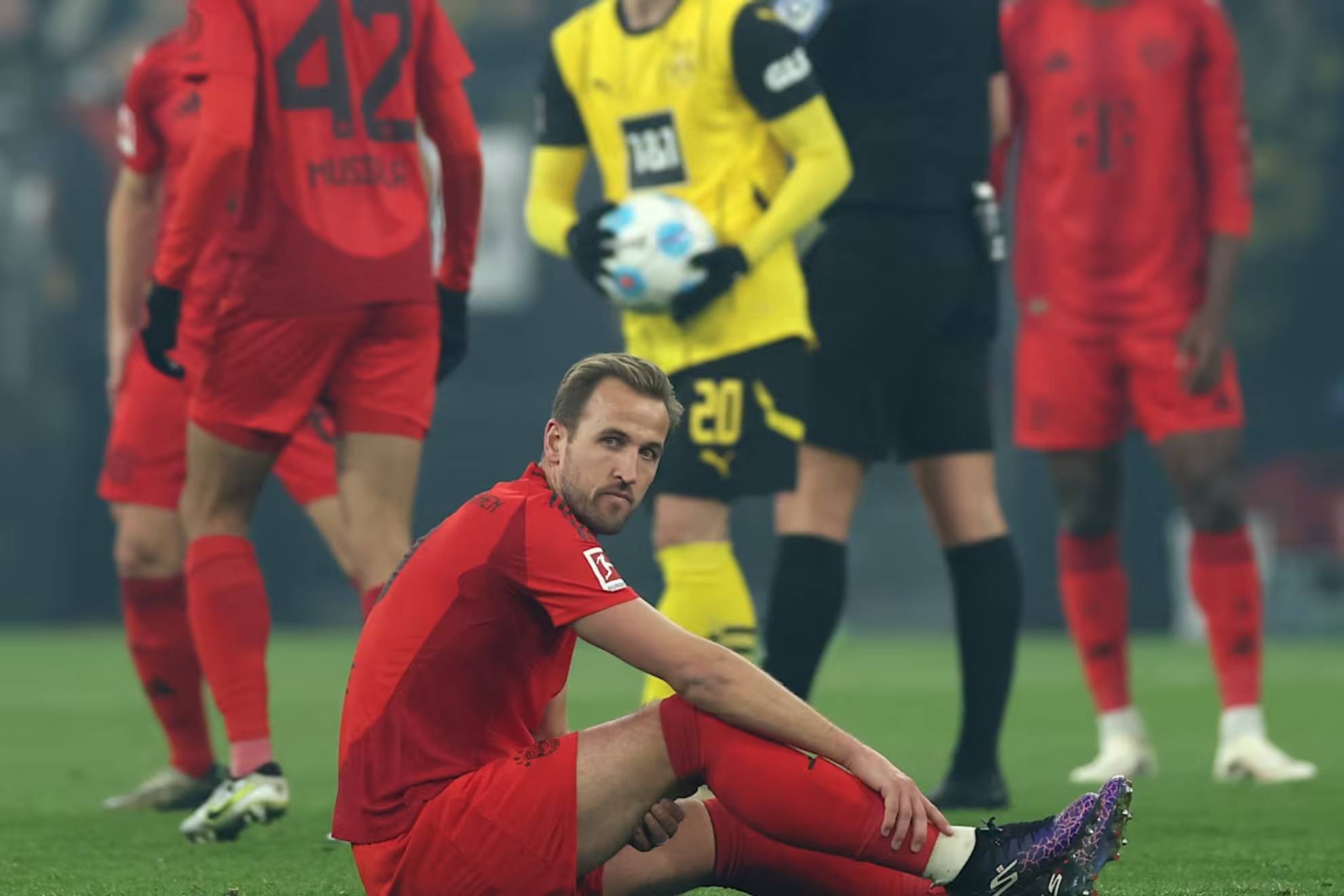 Harry Kane lying on the pitch in the match against Borussia Dortmund.