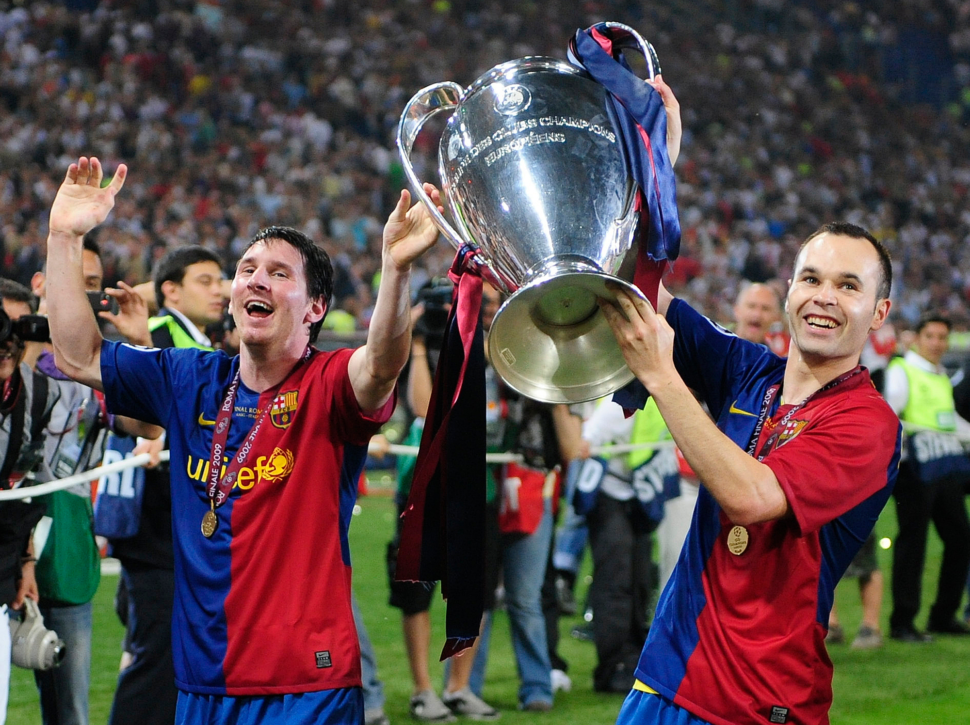 Messi, lifting the 2009 Champions League with Iniesta