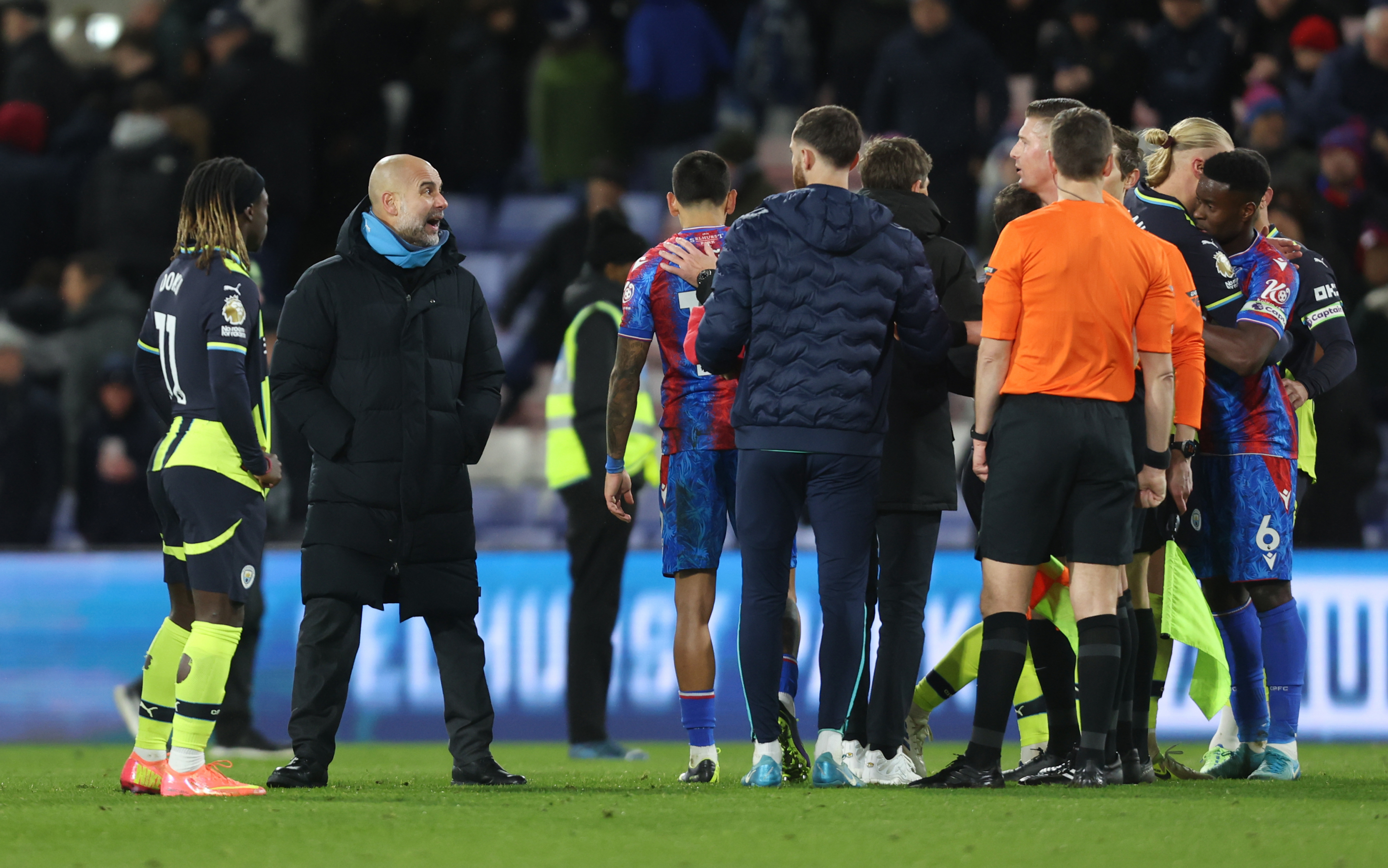 Guardiola insistently protesting to the referees.