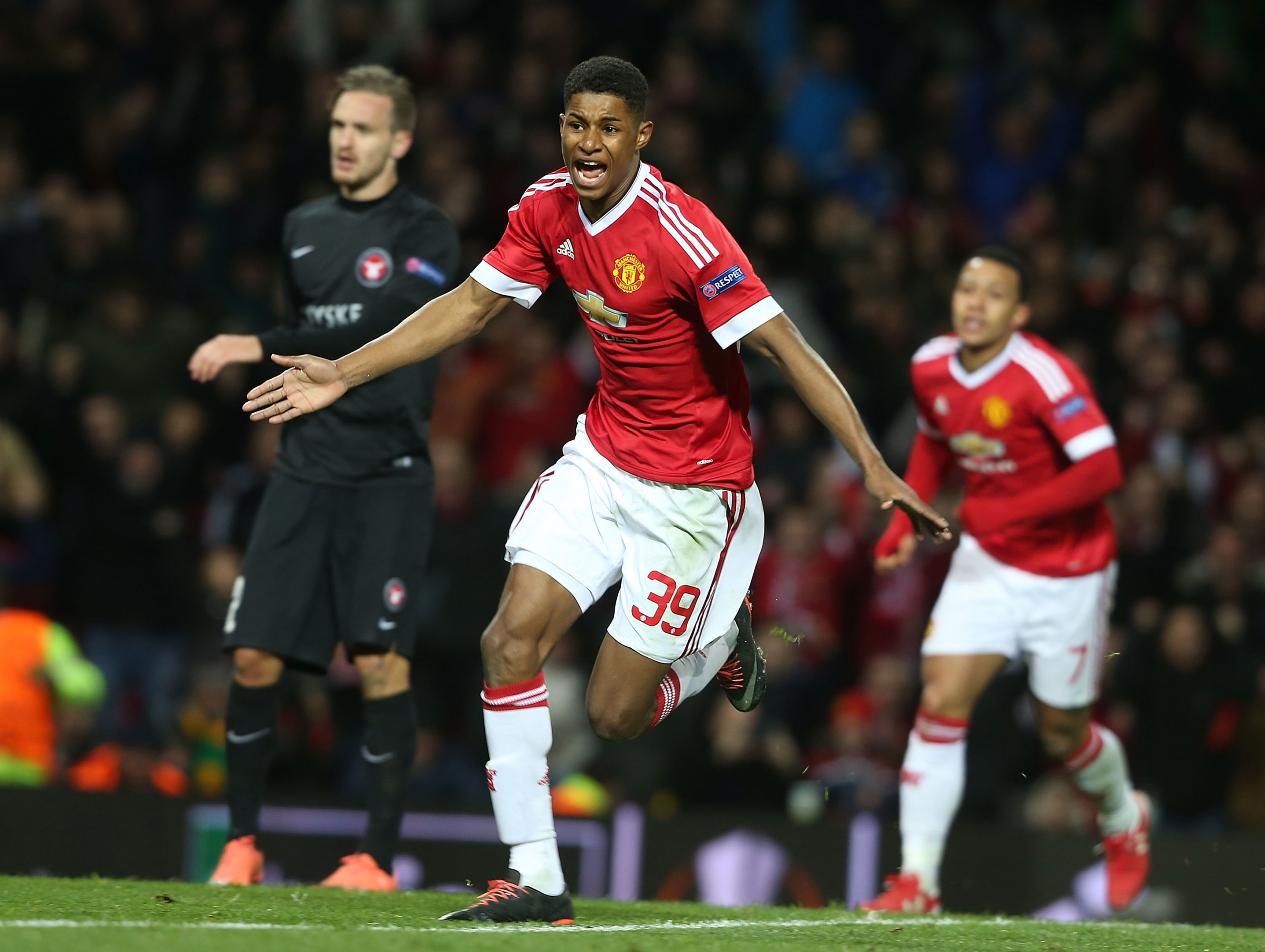 Rashford celebrating one of the two goals he scored on his debut for ManU.