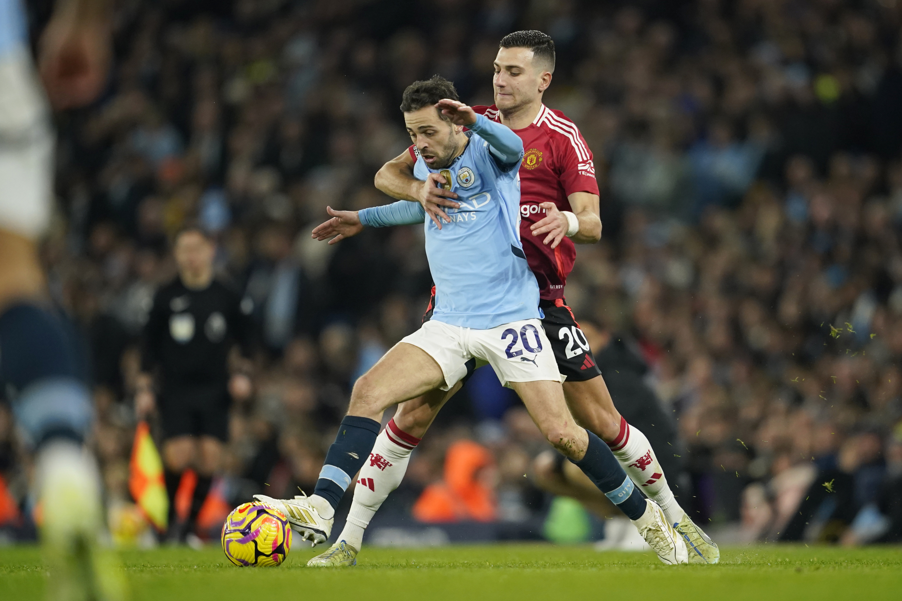 Bernardo Silva fights for a ball in the derby.