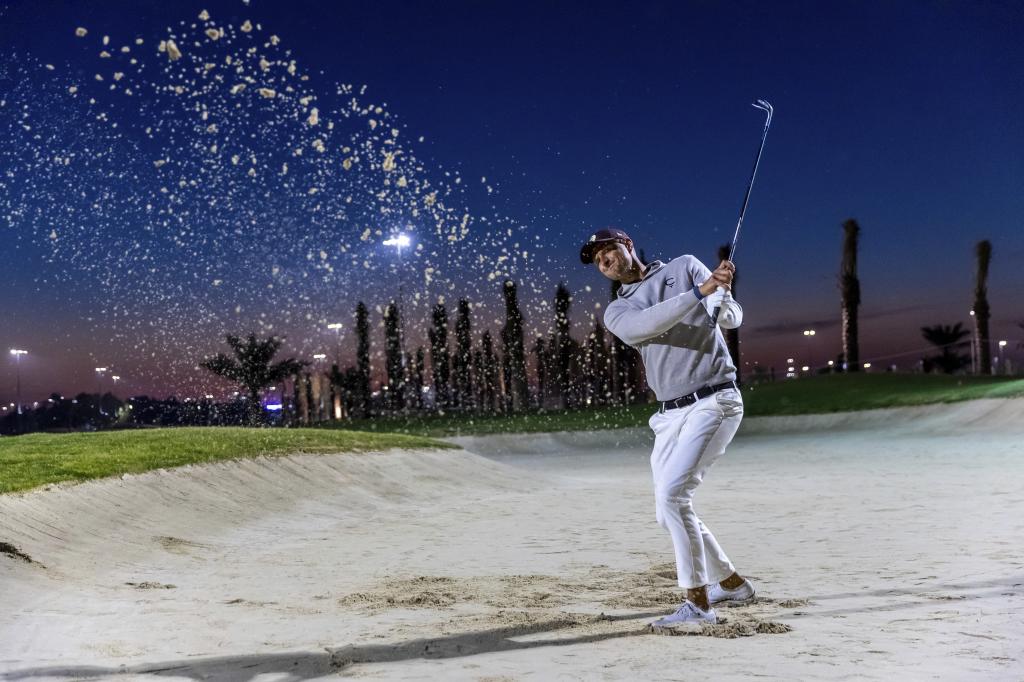 Adrian Meronk plays a ball from the bunker