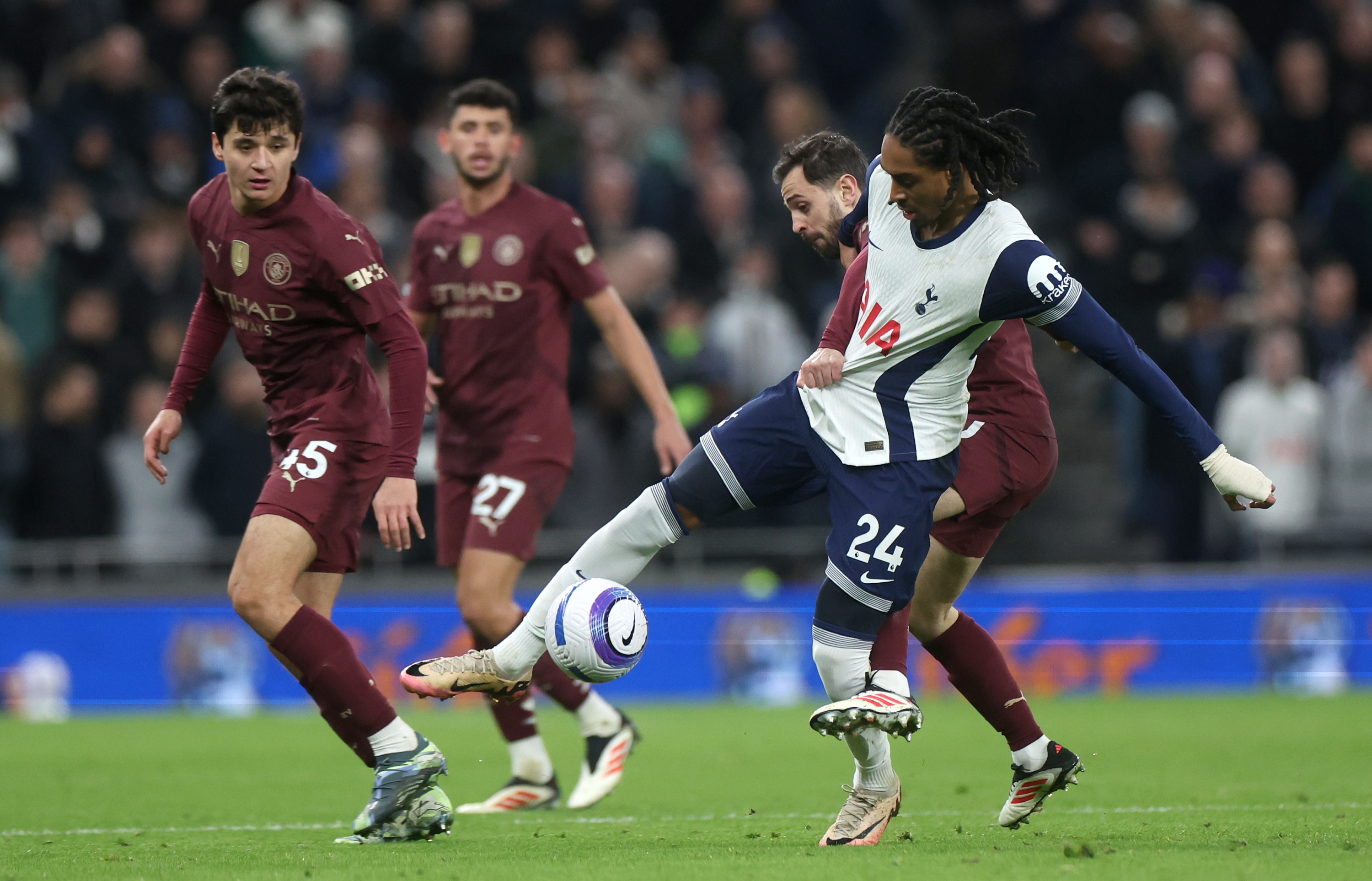 Khusanov and Bernardo Silva, in a duel against Djed Spence.