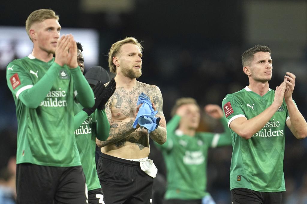 Plymouth players applaud their fans after falling into the City's fief.