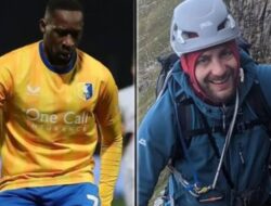 An international footballer plays a game after declaring himself guilty of the death of a cyclist